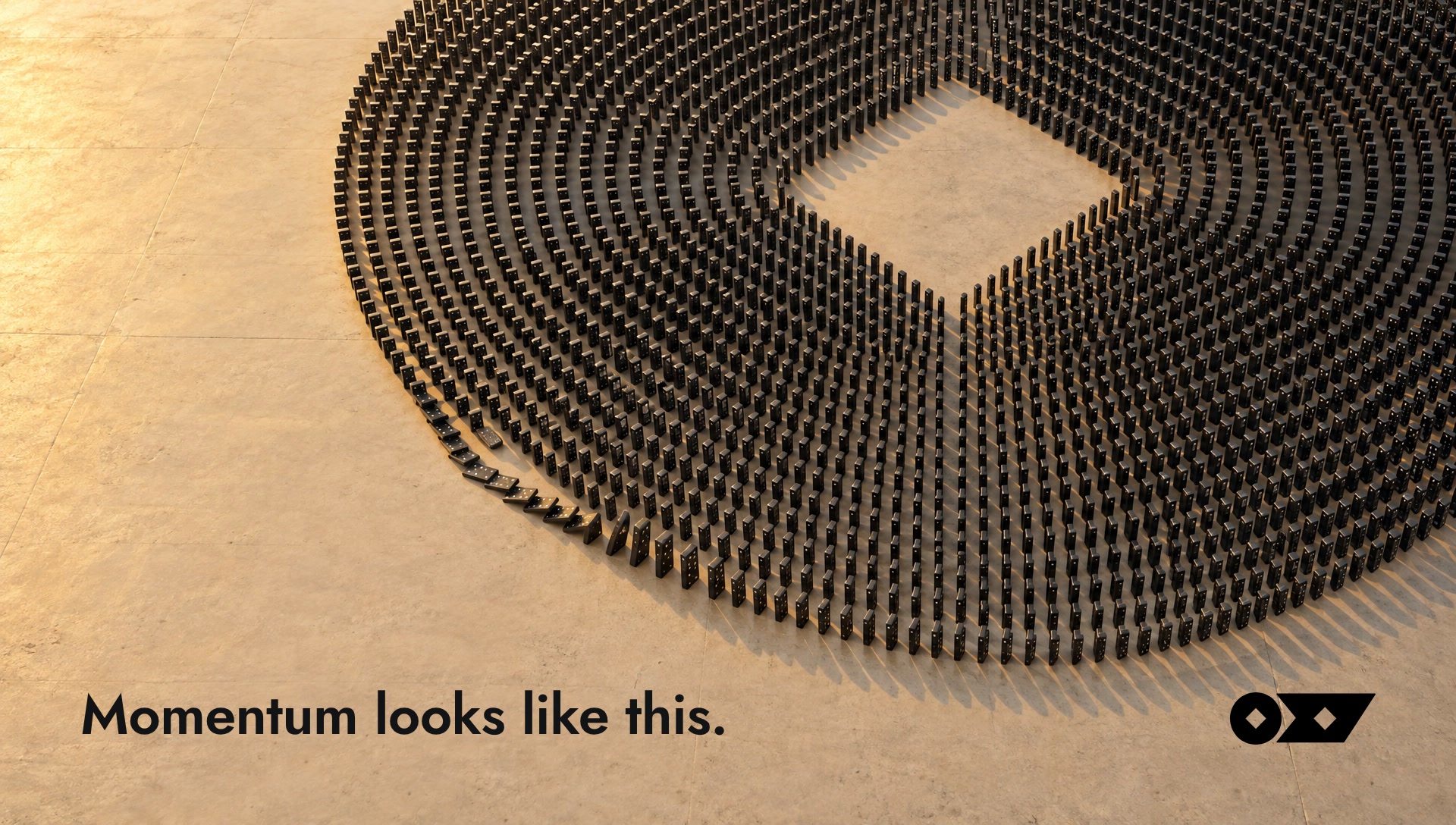Key art: thousands of dominoes forming the circle of the Oxy mark, first tiles falling